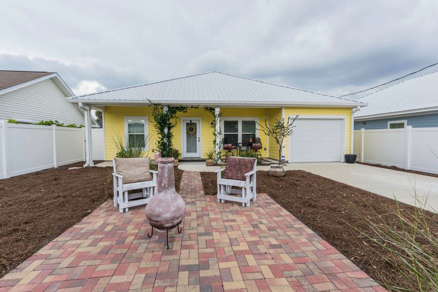 You will feel right at home in this bright, happy, sunshine yellow beach home in the golf cart friendly neighborhood of Riviera Beach in Sunnyside on the West End of Panama City Beach just minutes from 30A! Located close to parks, shopping, dining and only a short 1/2 mile golf cart ride to the World's Most Beautiful Beaches! This home was built just a few short years ago so everything in this home is practically BRAND NEW and boasts 9' smooth ceilings, stainless Whirlpool appliances, granite countertops, porcelain tile wood plank flooring throughout, metal roof, heat pump, gorgeous oversized tile master shower, low maintenance landscaping and the washer and dryer convey with the sale! Verify measurements if important.