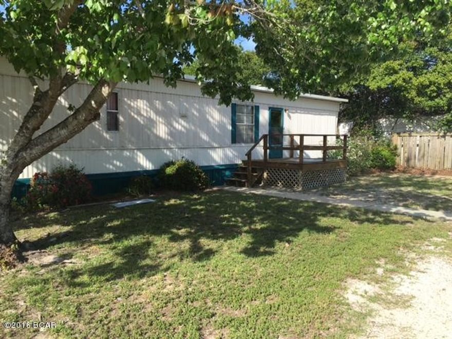 This home has been lovingly cared for by owners. The entire home was re-plumed last year.  The septic tank was recently cleaned and all tree roots removed.  Three to four inches of insulation was placed under  new metal roof.  Owners purchased a new washer and dryer for laundry room.  There is a large screened in bonus room that overlooks the fenced back yard.  There is a stick built double car garage with lots of room for storage.  This home would make a great beach home.