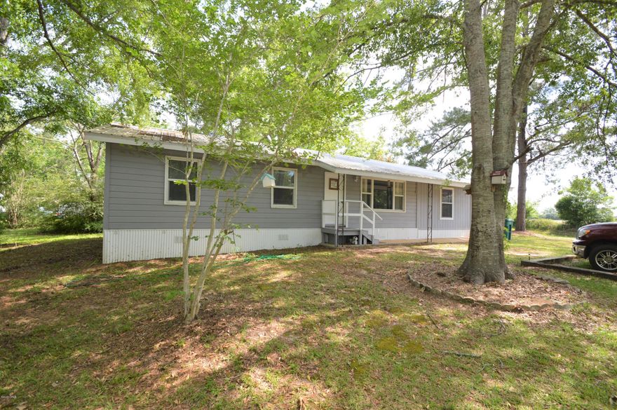 Nice 4 bedroom, two bath home located on a paved road.  Sitting on 6 acres, this property features a pond, as well as a 10x16 double lofted outbuilding. This is a must see!