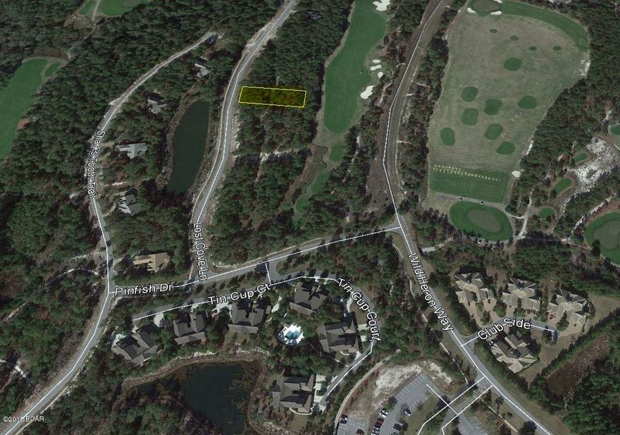 Oversized ''B'' lot on the #10 fairway of the famed Sharks Tooth Golf Course. Wild Heron is an upscale, gated community nestled alongside beautiful Lake Powell. Featuring a unique Coastal Craftsman architecture and offering exclusive amenities. Become one of the fortunate few to enjoy this privileged coastal lifestyle! BEST PRICE AVAILABLE ON THE GOLF COURSE!! Priced to sell quickly.