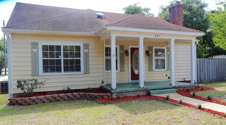 Florida cottage in the heart of Panama City. Just down the road from Bay Medical Center and Historic Downtown, which is the home of the Panama City Marina, Marina Civic Center, First Friday Events, Christmas Parade, etc. The home is cute with an open floor plan, many updates, remodeled kitchen and dining room, hardwood floors, upgraded windows, and fireplace. There are two small bedrooms upstairs that could also be an office or hobby room. There is a single car garage with workshop and a large fenced backyard. The home sits on a corner lot within walking distance to Massalina Bayou. Age, Square Footage, and room sizes approx, if important please verify.