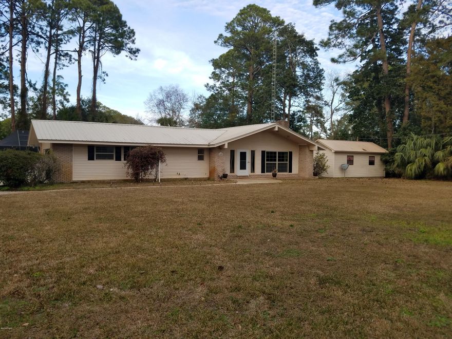 Located in St. Andrews, this home is situated on a spacious lot and offers tons of storage space. Exterior features include a screened pool, attached 2 car garage, a separate 2 car detached garage with workshop, and greenhouse. Interior features include a vaulted ceiling in the living and dining area, updated master bathroom, and Florida room. Rent includes pool service. Pet negotiable with $250 non-refundable pet fee. Washer/Dryer hookup.