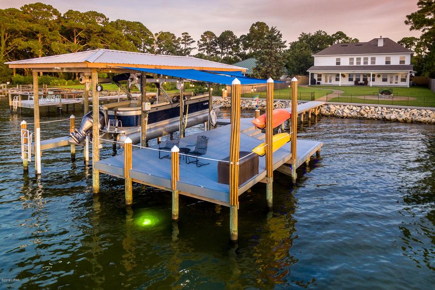 Why wait?  Waterfront living at it's finest. NO HOA. This beautifully designed home has a coveted open floor plan.  Choctawwatchee Bay is right out your backdoor. Plenty of room to add a large pool if you wish. Lots of natural light. Folks who have these interests would be best

suited for this property: Boating, Fishing, swimming, craftsman woodworker's dream space or antique car collector's dream garage. Home has exquisite finishes with granite, Electrolux stainless, gourmet kitchen, separate formal dining, custom tiled backsplash, Craftsman

trim work and lighting, two Rinnai tankless gas hot water heaters, gas fireplace and Generac Backup Generator. Dog Friendly Lot.  All water toys are for sale.  They will convey with full price offer. 265 Crest Drive Upgrades (Included in Sale Price)
Home: 4425 Sq. Ft.
Additional Detached 3-car Garage: 875 Sq. Ft. 
Total Covered Space: 5300 Sq. Ft. 
3 Car Detached Garage / Shop: 
"	35X25 = 875 Sq Ft
"	10' ceiling with 2"X6"walls
"	Separate power panel from house
"	Wired for 110V and 220V with multiple plugs in the walls, floor and ceiling
"	Air Compressor Lines run in wall and ceiling with outlets on the walls and ceiling.
"	Epoxied floor with Rust-Oleum RockSolid Gunmetal Metallic Garage Floor Coating 
"	LED recessed lighting
"	Shop sink
"	Gutters on all sides
"	Mitsubishi wall mounted heating and cooling unit

Attached 2 Car Garage with Additional Golf Cart Bay:
"	Resurfaced garage floor with Daich Spread Stone and clear epoxy giving it a marbled stone look
"	Two Wall Mounted fans
"	110V Plug for Golf Cart
"	110V Plug for Extra Refrigerator

House:
Study 
"	Ceiling fan with light kit
"	In wall wiring for TV 
Living Room
"	Ornate Mexican mahogany wood fireplace surround 
"	Floating shelves on both sides of fireplace with LED lighting and power outlets 
"	Remote control added for ceiling fan
"	In wall wiring for TV
Kitchen
"	Samsung Refrigerator
"	Upgraded downstairs thermostats to Honeywell TH321WF10D1/U WI-FI with outdoor sensor
"	Extra Shelf in pantry
"	Dimmer switches for island light pendants 

Laundry Room
"	Built in Ironing Board with 110V plug in Laundry Room
Bar Area
"	Dimmer switch for bar light
Dining Room
"	Dimmer switch for chandelier 
Master Bedroom / Bath
"	Upgraded thermostat to Honeywell TH321WF10D1/U WI-FI with remote room sensor and outdoor sensor
"	Blinds on bedroom windows and doors
"	Lighted Makeup Mirror in Master Bath
"	In wall wiring for TV


Upstairs Bedrooms/Bathrooms and Media Room
"	Ceiling fans with light kits in all 4 bedrooms and ceiling fan in Media room
"	Glass Shower Doors added in both upstairs bathrooms
"	Media Equipment Cabinet from Mexico
"	In wall wiring for TV


Outside Front
"	Generac Generator
"	Full house surge protector
"	Full house gutters
"	Pavers extended around new detached 3 car garage and side of house 
"	Resurfaced Front porch Daich Spread Stone and clear seal giving it a marbled stone look
"	Landscaping
Outside Back
"	New back yard fire pit with grate and full screen
"	Pavers extended by outside shower with a pathway to the fire pit and dock
"	New wood fencing alongside of house by new pavers and extending down to sea wall 
"	3 Outside LED flood lights  both sides and back
"	Resurfaced Back porch with Daich Spread Stone and clear seal giving it a marbled stone look
"	4 Outdoor Ceiling fans on back porch
"	Back porch sunshade
"	In- ground irrigation pump with American Hydro Systems 2650 30-Gallon GreenFeeder Siphoning Feeder System.
"	Landscaping
Dock
"	Wrought iron fence with gate along seawall
"	New seawall cap /walkway 
"	Rebuilt Dock and added Swim Platform 
"	Added Metal boathouse roof
"	Pelican wind vane on boathouse roof
"	6 Dock 6' bumpers lining interior pilings of the boat house 
"	Multiple 8" boat cleats around dock
"	Pilings wrapped in wood and capped with white caps 
"	White Rope between pilings
"	6000-pound Beltless boat lift with Remote and Auto Stop
"	Water to dock with separate cut off from house
"	Power to dock  110V and 220V (110V Lights and Outlets / 220V Boat Lift)
"	5 LED Dock flood lights
"	LED blue rope lighting wrapping the underside of the dock with timer
"	Deep glow green underwater dock fishing light on timer
"	Two kayak racks with cable locks 
"	2 Blue Dock Sunshades
"	Outdoor Italian bistro style LED string lights
"	2 Dock ladders
"	Storage box

Water Toys are Negotiable
"	2018 250 Crest II SLC Salt Water Series Pontoon Boat  25'  (3) 25" Round Tubes, Aluminum Underskin, SeaStar Hydraulic Steering, Junior Beast Ski Tow Bar - GPS Lowrance HOOK 4, Premium Audio, Full Boat Cover, Privacy Curtain & Frame  Seagrass Flooring  Dual 29" Highback Recliners - Dual Battery Switch - Coast Guard Kit - 150HP Yamaha with 20 hours of operation
"	2 Old Town Heron 11XT Kayaks with Paddles and Life Vests
"	4 TRC Recreation Super Soft Adjustable Recliners
"	2 Recreation Ultra Sunsation Floats