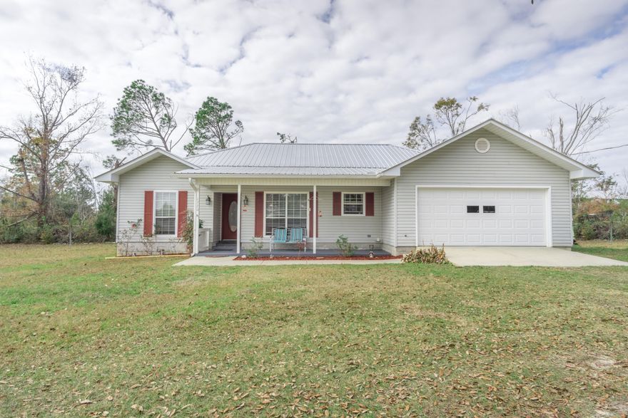 Move in ready home sitting on a paved road. The living area features an open floor plan.  Split bedroom floor plan featuring 3 bedrooms, two baths.  The back of the home features a nice addition.  Barn is 24x36 and property features a pond.  Conveniently located.