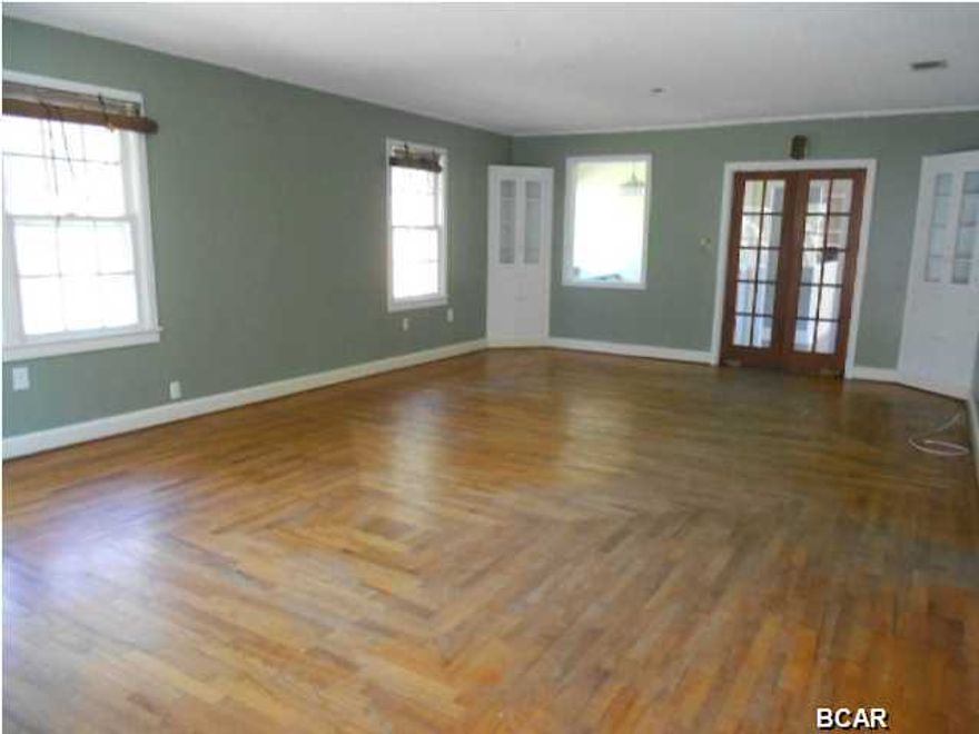 Lovely home in Historic Millville. New metal roof less than 2 years old, Original wood floors, enclosed front porch, garage, yard is completely fenced.
