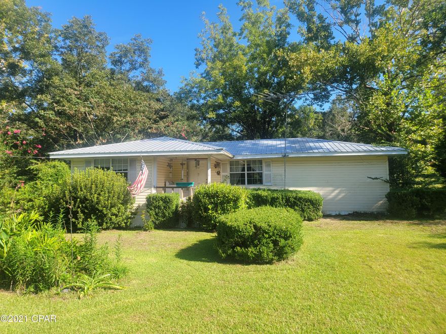 Great investment opportunity with this 3/1 home just outside the city limits of Chipley. Home has an open living and dining area. Spacious kitchen. Split floorplan with large master off of dining area, 2 additional bedrooms and full bath off of living room. Home has some original hardwood floors in place. Laundry room with sink. Metal roof installed in 2016. Beautiful 1.1 +/- acre lot. There is 2 outbuildings for additional storage. Needs some work but will make a nice rental or homestead. Cash or conventional offers only.