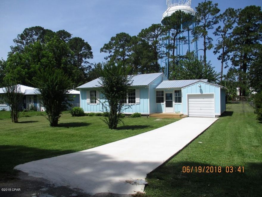 REDUCED!!!!! Cottage Style Florida home renovated and ready for you!! 3BR/2B with 1,168 SF living area and 2,196 SF total. New Roof, hardiboard siding, plumbing, wiring, kitchen, appliances, bathrooms, painted, flooring in back portion. Front of home has original hardwood floors. Large deck off breezeway area. Attached one car garage with new concrete driveway. Large Lot with fenced back yard and storage building. Azalea bushes along front of home and crape myrtle in the front yard. They have been cut back but will grow out and add color to the front of home. Located 1 block from the walking trail, 3 blocks to the bay and boat ramp and a short distance from down town with shopping and restaurants. Also located in a Golf Cart Community.