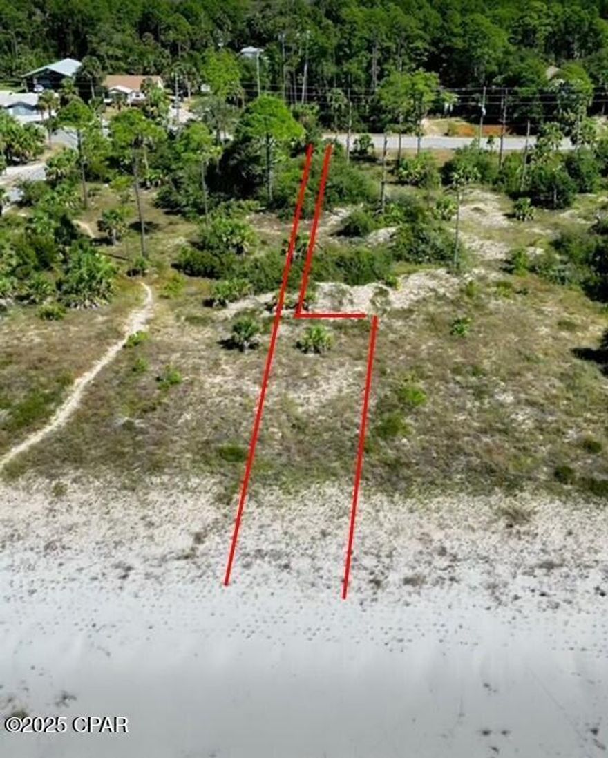 Looking for a rare beachfront opportunity with privacy, low flood insurance potential, and strong short-term rental appeal? This 'Diamond in the Rough' 0.60-acre gulf front lot checks all the boxes. The driveway is 10' x 264' that opens into remainder of lot at 52' x 400', where the home would sit and in similar alignment with other gulf front homes. This area is level and ready for your plan. The lot widens to 62' at waterfront. Situated in Gulf County, this parcel offers an ideal build site in the A Flood Zone, access to miles of sandy shoreline, and unique neighboring protection from development—making it one of the most compelling gulf front lots on the market today. Enjoy direct access to the beach and unobstructed sunset views from your future home. The vacant bordering lot to the west is owned by the State Buffer Preserve, offering natural buffer and added seclusion that many buyers seek. The property is noted to be in a FEMA eligibility area, an important consideration for financing and mitigation planning. Gulf County has pet friendly beaches and allows pets on leashes. Close to Indian Pass boat ramp (˜3 miles). Salinas Park (˜1 mile west) and features pickleball courts, playground, screen house, fire pit, and a boardwalk on the bay—perfect for families and active lifestyles. Dining and groceries a short drive away. Long stretches of shoreline for walking, shelling, fishing, and picture-perfect sunsets. This lot is waiting for you to build your dream beach home!!