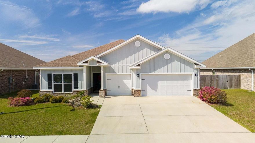 Welcome to Titus Park, one of Panama City's most desirable communities! This home showcases an exclusive floorplan you won't find often, complete with a versatile bonus suite perfect for a mother-in-law setup, home office, or private guest retreat. Inside, you'll find spacious open-concept living, a modern kitchen with sleek finishes, and abundant natural light throughout. The bonus suite provides flexibility for multigenerational living or extended stays, offering privacy while keeping everyone connected under one roof. The oversized 3-car garage is a dream for car enthusiasts, those needing extra storage, or anyone envisioning their own garage gym or hobby space. Enjoy access to the community pool, ideal for relaxing weekends or after-work swims. Just down the road, convenience abounds with a Publix shopping center featuring Starbucks, and exciting new additions, a McDonald's under construction and a Mexican restaurant coming soon, plus more local favorites nearby. Families love Titus Park for its proximity to North Bay Haven Charter School, while commuters and military personnel appreciate being only 14 miles to Tyndall Air Force Base and 6.9 miles to Gulf Coast Hospital. Experience the perfect blend of comfort, convenience, and community, all in the heart of Panama City's growing north side. Homes with this layout rarely come available, so schedule your private showing today!