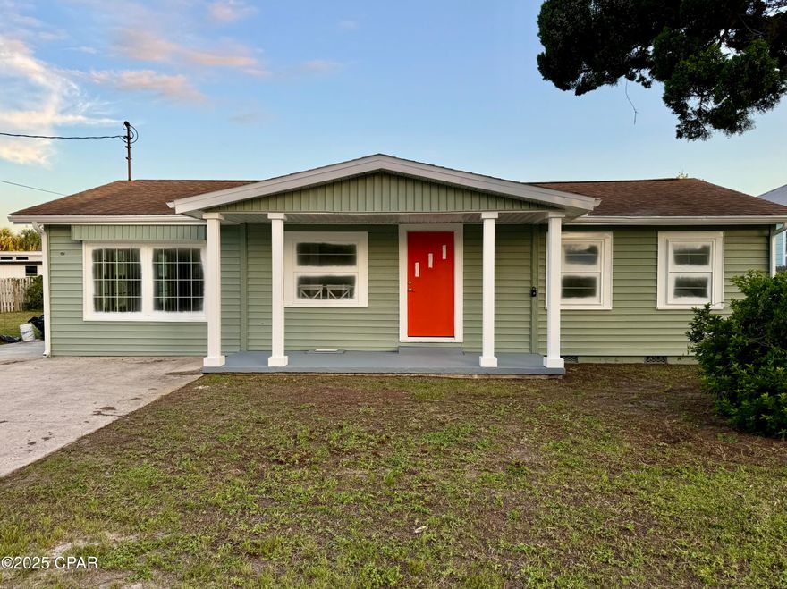 Under Contract - Seller accepts backup offers. Welcome to your coastal retreat! This spacious 3-bedroom, 1-bath home is located in a quiet beachside neighborhood on a rare double lot, offering plenty of room to relax, entertain, or expand. Less than half a mile from Public Beach Access #9, you'll have the sand and surf just a short walk away.

Inside, you'll find stylish new LVP flooring, an updated bathroom, and a beautifully renovated kitchen with brand-new cabinets and appliances. The home also features a bright Florida room and a 12x18 enclosed porch—perfect for relaxing or hosting guests year-round.

Step out back to a generously sized yard, ideal for creating your own outdoor oasis where you can enjoy Florida sunsets in privacy with family and friends. The septic system is located on the west (right) side of the home, leaving ample space in the backyard for future projects or landscaping dreams.

Don't miss this unique opportunity to enjoy spacious, beachside living with room to grow!