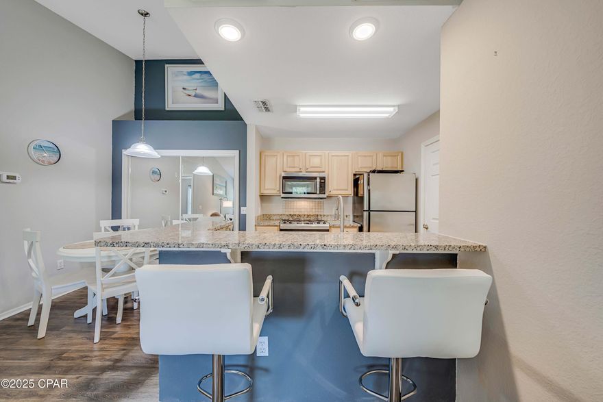 Live the beach life at Nautilus Cove, a gated condo community in Panama City Beach just ½ mile from the Gulf's white sandy beaches! This 2-bedroom, 2nd-floor condo is filled with natural light and offers extra privacy with no upstairs neighbors.

Recent updates include a 2023 HVAC system, and your low-maintenance lifestyle is made easy with HOA fees that cover water, sewer, garbage, landscaping, and community amenities.

Enjoy resort-style living with a pool, clubhouse, fitness center, BBQ area, playground, and plenty of green space for pets—with the playground and pool right outside your door.

Perfectly located less than a mile from the beach and only 2 miles to Pier Park, you'll be close to shopping, dining, schools, and entertainment. Attractions like Top Golf, Dolly Parton's Pirate Voyage, and Camp Helen State Park are just minutes away.

Whether you're looking for a primary residence, second home, or investment property, this condo has the location, amenities, and updates you've been searching for.