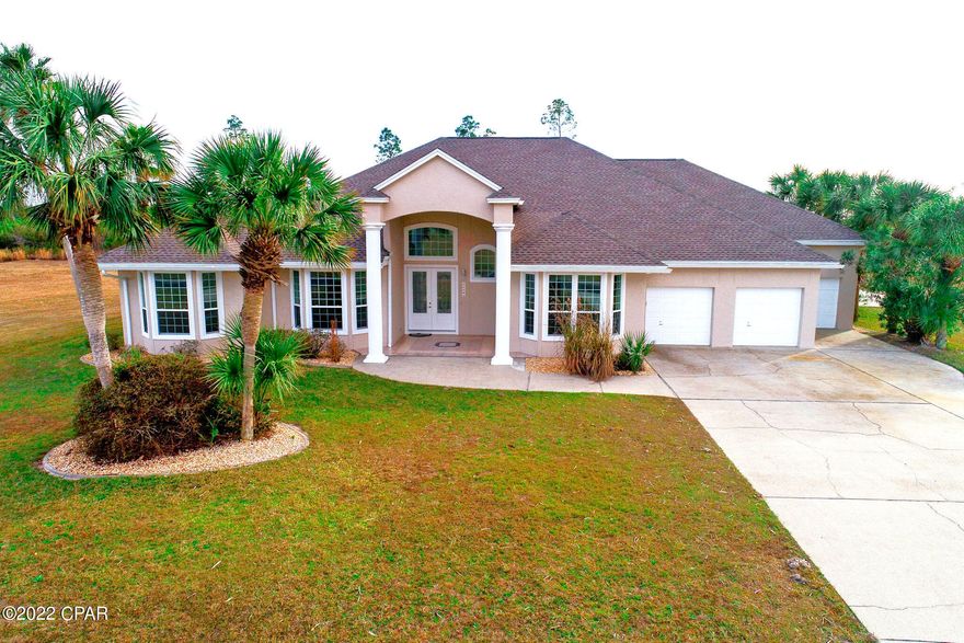 CURRENTLY UNDER CONTRACT SELLER ACCEPTING BACK-UP OFFERS Contemporary home located in gated/fly-in community of Sandy Creek Air Park. Includes a 3300 ft. paved runway, FAA designator 75FL. This home has been newly remodeled. Has new roof and gutters, new windows and doors, newer A/C, new garage doors openers, new pool equipment, new pool enclosure, pool deck, and the pool has been reconditioned, stucco has been recoated, and new landscaping. Home features Italian style tile throughout, a kitchen with solid oak cabinets, solid surface countertops, and breakfast nook, formal dining, living and family room, spacious laundry room, large bedrooms, and a master suite with dual vanities Jacuzzi and separate shower and spacious closets. 3 car garage,