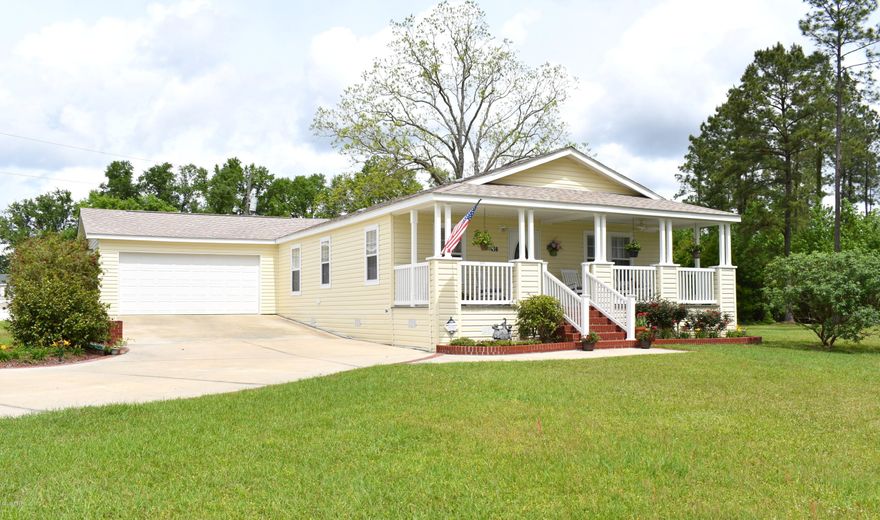 CURRENTLY UNDER CONTRACT, SELLER ACCEPTING BACKUP OFFERS.From the moment you pull in the driveway you will be in awe! This 3 bedroom 2 bath custom modular home sits on more than 13 well manicured acres and boast an open concept kitchen/living area with breakfast bar, large pantry, crown molding/textured walls throughout, spacious laundry room, master suite with massive walk-in closet, soaking tub, separate shower and double vanity. Enjoy your time outside sipping coffee on the front porch, swimming in the pool, tanning on the deck or walking through the pines. Other outside features include a 2 car attached garage, concrete driveway, luscious landscaping, partially fenced yard and detached storage building. Property is located directly off Hwy 79,a short drive to I-10 and Panama City Beach