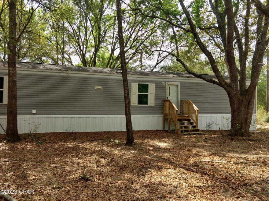 OWNER MOTIVATED! MAKE AN OFFER, Beautiful new 3 bed 2 bath home on a double lot. Pretty hilltop setting with lots of large shade trees. Has a new deep well and septic system. Located close to the new schools and convenient to local shopping. Affordable living at its best. Make an appointment to see it today. NEED FINANCING, WE CAN HELP. POSSIBLE OWNER FINANCING WITH 30 PERCENT DOWN.