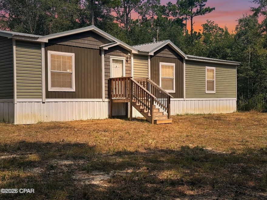 PRICE REDUCTION!!  If you want privacy, this is your place!  This 2022 3 Bedroom, 2 Bath Double Wide Mobile Home is situated at the end of the road through a gated shared entrance surrounded by beautiful oaks on the spacious 1.7 acre lot.  The home features lovely farmhouse finishes with a split bedroom plan in an open living space with fireplace.  Home looks brand new.  The home is located at the end of the road with a shared gated entrance.