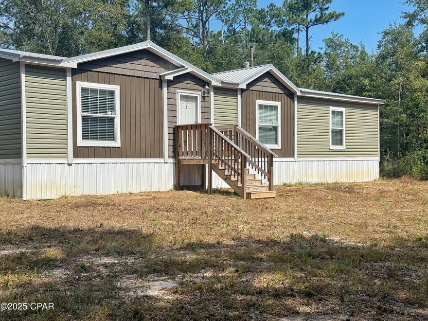 PRICE REDUCTION!!  If you want privacy, this is your place!  This 2022 3 Bedroom, 2 Bath Double Wide Mobile Home is situated at the end of the road through a gated shared entrance surrounded by beautiful oaks on the spacious 1.7 acre lot.  The home features lovely farmhouse finishes with a split bedroom plan in an open living space with fireplace.  Home looks brand new.  The home is located at the end of the road with a shared gated entrance.