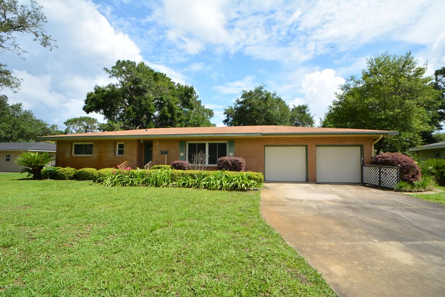 Wonderful opportunity to create your masterpiece in the desirable and centrally located Island View Estates. This three bedroom, two bath all-brick home offers over 2000 square feet of living space, a sun porch, garage with additional storage, a workshop and RV parking through the rear-entry gate to the back yard. The large living/dining room combination has lots of natural light. The family room with brick fireplace is open to the kitchen. The master bedroom has a walk-in closet and a private entrance to the sun room. The backyard has a covered patio and a block workshop with additional covered areas. There is also RV parking and a rear gate for easy access. Call your Realtor and see the potential for yourself today!