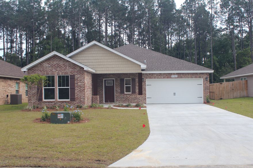 Stunning new construction home in popular Pines Of Lynn Haven Sub.  This beautiful home has all the upgrades you would want.  The 9' ceilings feature step up tray ceilings throughout, split floor plan, beautiful crown molding, thick baseboards, LED lighting, vinyl plank flooring, double pane windows, security lights, recessed lighting, upgraded fixtures and tasteful wall trim.  The great room is perfect for entertaining and the open kitchen has plenty of room for guests.  The kitchen features custom cabinets, quarts counter tops, stainless appliances, island sink with breakfast bar, and custom pantry.  The master bedroom offers plenty of natural light with step up tray ceiling, while the master bath offers double vanity, large walk-in closet and a huge custom shower. The exterior of the home offers a sprinkler system, covered front and back patios and a separate reclaim meter for sprinkler system to save money on watering.  There are no HOA fees and the home is close to Lynn Haven shopping, Lynn Haven Recreation Center, Bay Haven, North Bay Haven and Mosley High School.