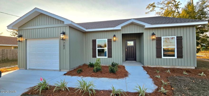 Welcome to Your Dream Home in a fabulous location on the east side! Brand-new construction on a huge corner lot in an unbeatable location! Situated just steps away from the Parker Environmental Park and Sports Complex, your family will enjoy instant access to recreational amenities including tennis and pickleball courts, basketball courts, a dog park, a playground, and a boat ramp servicing Martin Lake. Parker Elementary is literally one block away, and Tyndall Air Force Base is less than 5 miles away. Step inside and be wowed by the high ceilings and luxurious plank floors. Professionally curated lighting, custom color schemes, and upgraded fixtures add a touch of sophistication to every corner. Designed to delight the culinary enthusiast, the kitchen boasts soft-close Shaker cabinets, upgraded granite countertops, and stainless steel appliances. The expansive master bedroom features a generous walk-in closet, while the ensuite master bath offers double vanities, a beautifully tiled shower with a custom glass door, and granite countertops. ''You will rest well knowing that your new home has upgraded hurricane-rated impact glass windows, so no need to board up when a storm approaches''. This home is equipped with smart features for convenience and energy efficiency, including LED lighting throughout, WiFi-enabled garage door opener, thermostat, and irrigation system. The garage gives you plenty of room for parking and storage. Outside, discover your own private oasis with a massive 100x138 sodded and irrigated corner lot...plenty of room for backyard sports, entertaining or storage. With designer interior touches, a garage for convenience, and every detail attended to, this home is move-in ready for your family. Don't miss out on this opportunity - seize it now before it's gone