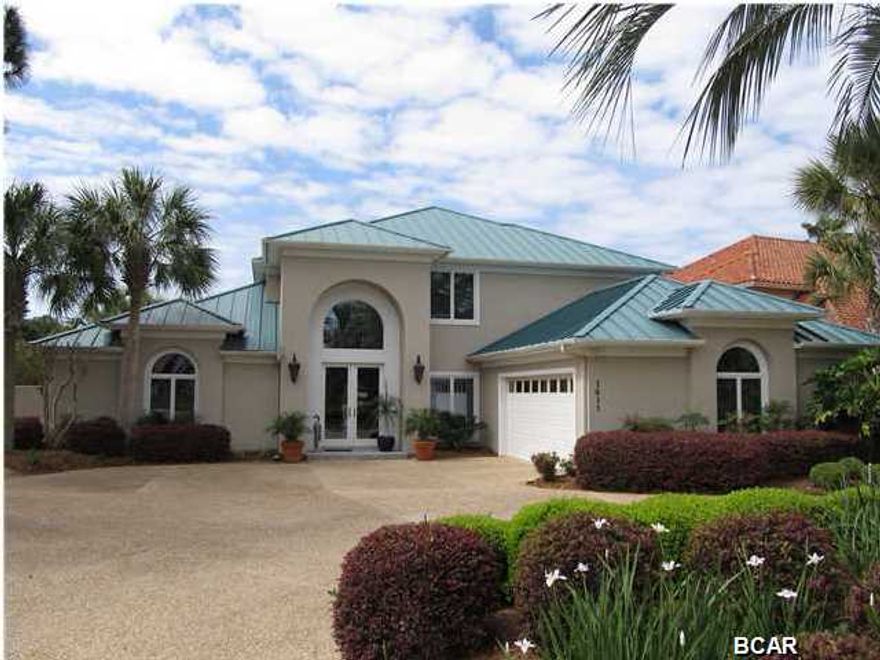 SELLER SAYS ''SELL THIS HOME''! New Paint! Every room of this One Owner - Custom Built home has just been painted and it is Move in Ready! Gorgeous 4 Bedroom/4 Bath home on the canal in Bay Point! This is a must see home with 75 feet on the Bay Point Canal. The floor plan is welcoming and open, with lots of natural light. A well built home with all the upgrades! A wonderful family home! You will love the spacious rooms, hardwood floors, fantastic open kitchen, screened in porch, and large patio with POOL. The over sized master bedroom is on first level for easy living. The master bedroom opens to the pool deck and has a sitting area and spacious his and hers bath - literally 2 of everything except for the whirlpool bath! 2nd level has 3 bedrooms and 2 additional bathrooms as well as a