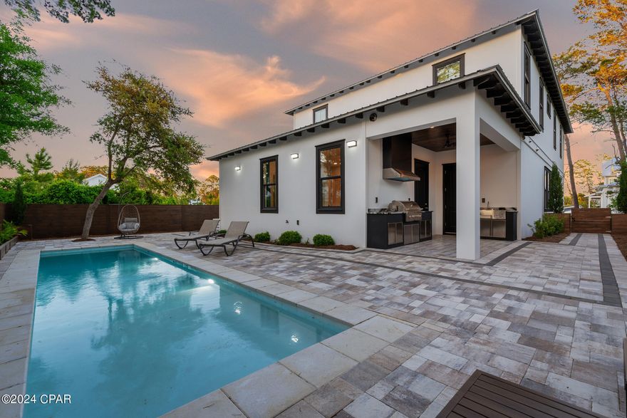 HEATED SALTWATER POOL!! Step inside this newly constructed 4-bedroom, 3.5-bath coastal residence, where meticulous attention to detail and the finest materials have converged to create an exceptional living space. The open floorplan with 10' ceilings greets you as you enter. The heart of this home, the open kitchen and living room, is designed for both gourmet cooking and entertaining. The kitchen is a masterpiece of practicality and aesthetics, with marble countertops, a professional-grade gas range, high-end KitchenAid appliances, and a captivating stone backsplash. The first-floor master suite redefines luxury, featuring double sinks, a custom-tiled shower, and a stone soaking tub, offering the ultimate space for relaxation. Upstairs, you'll discover three more beautifully appointed bedrooms, including a second master suite, and two bathrooms, along with a generous sitting room/library perfect for game nights or moments of relaxation. Step outside into your private retreat, where an outdoor kitchen invites al fresco dining and stylish entertaining. The backyard space features swimming pool, enhancing the quintessential coastal lifestyle. The Preserve At Inlet Beach features community pool and a dock with access to Lake Powell in your kayak or paddle board. Located on the East end of 30A, this home provides proximity to 30 Avenue shops and restaurants, ensuring both convenience and access to the neighborhood's vibrant atmosphere. Beach access is just a short walk away or a convenient golf-cart ride, with a pedestrian tunnel under Hwy 98 coming soon for added convenience. The community's flexibility for short-term rentals makes this home an excellent addition to your investment portfolio or a charming vacation retreat. Beyond just a residence, this home is a testament to quality and the promise of an unparalleled coastal lifestyle. Don't miss this unique opportunity to make it your own.