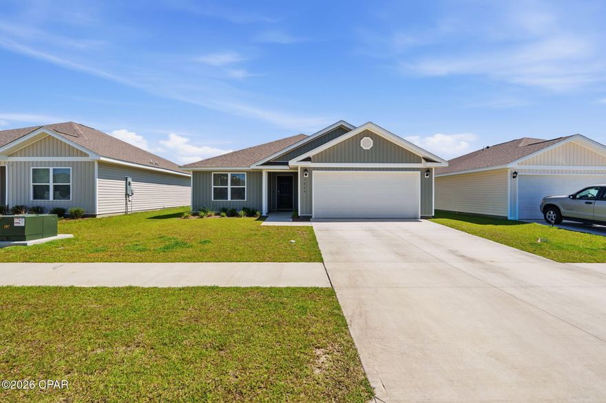 Welcome to 7066 George Day Lane in the highly sought-after Liberty community of Panama City! This move-in ready 3-bedroom, 2-bath home offers the perfect combination of modern design, everyday comfort, and valuable upgrades already completed for you. Best of all, the street construction is complete, allowing you to enjoy an established neighborhood feel without the inconvenience of ongoing building nearby.

Inside, you'll find a bright open-concept layout with durable vinyl plank flooring throughout the main living areas, granite countertops, white soft-close cabinetry, stainless steel appliances, and a spacious kitchen island ideal for entertaining or casual dining. The thoughtfully designed split-bedroom floor plan provides privacy for the primary suite while still offering comfortable guest bedrooms and bath space for family or visitors.

The spacious primary suite features a double vanity, walk-in shower, and large walk-in closet. Throughout the home, you'll appreciate features that many new construction homes do not include, such as installed blinds and a fully fenced backyard with 6-foot white vinyl fencing for added privacy and security. The refrigerator can also convey with an acceptable offer, making your move even easier.

This home is also equipped with smart home technology, allowing you to conveniently manage features right from your phone, along with a professionally installed 3-stage water filtration system for enhanced water quality throughout the home.

Additional highlights include a two-car garage, dimensional shingle roof, and underground utilities. Residents of Liberty enjoy access to incredible community amenities including two pools, a splash pad, playgrounds, pickleball courts, basketball court, fitness center, yoga room, and more.

If you're looking for a newer home where the upgrades are already done and the home is truly move-in ready, 7066 George Day Lane is one you won't want to miss.