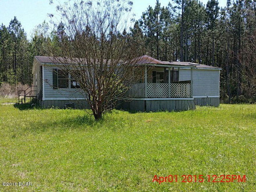10.49 Acres with a fixer-upper 3 bedroom 2 bath Doublewide Mobile Home. Home will need extensive repairs to make it habitable. Land is mostly wooded. Great spot for a new home or fix up the mobile home. Nice and quiet area with lots of wildlife and peace and quiet. Check it out!!!! Fix and Save.