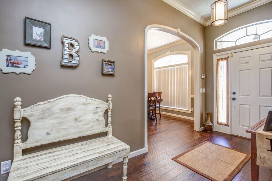 Are you searching for a three bedroom, two bath brick home located in North Harbor Landing area which is convenient to restaurants, and shopping? Search no more as you enter this all brick home you feel the warmth of this home featuring new wood floors, carpet, light fixtures and paint.  The open living area has a fireplace and French doors opening to the oversized porch and backyard.  The large backyard features a new back fence.  Enjoy cooking in the open kitchen overlooking the great room.  The kitchen has upgraded stainless steel appliances and the dining room features a new eye catching light fixture with large windows opening to the front yards.  The split bedroom floor plan provides the privacy of the master bedroom/bath suite.  Not detail has been overlooked in this home. Words can't describe this property so call your agent to schedule your private tour.  All information contained herein is believed to be correct, however buyer assumes all responsibility to verify measurements and information.