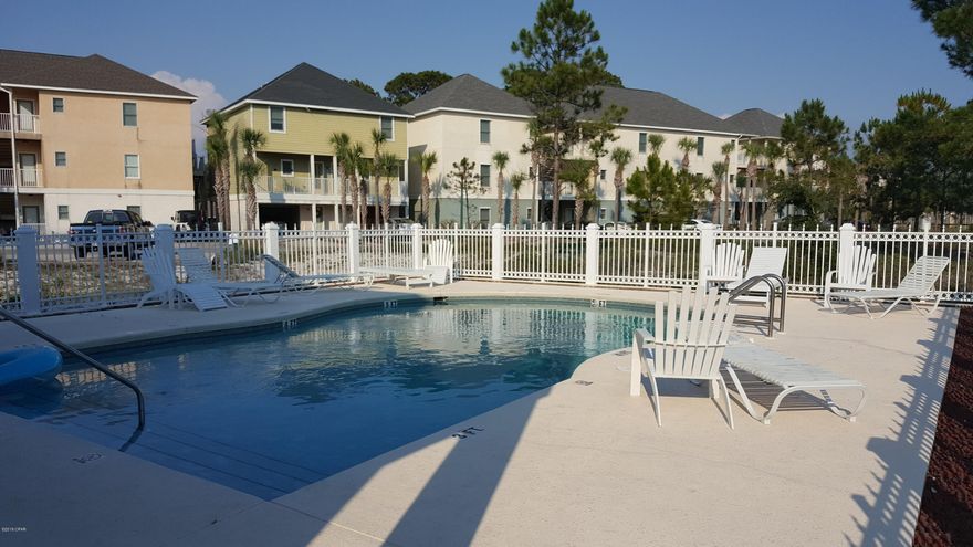 'CURRENTLY UNDER CONTRACT, SELLER ACCEPTING BACKUP OFFERS Super Cute beach house, located in the quaint community of Bonita Point, Enjoy all the things to do from Put Put Golf to Go carts, Resturants and shopping on the east end of Panama City Beach. Just a short one block walk to the Beautiful White sands of Panama City Beach, This home has an open floor plan design with Kitchen Living and a 1/2 Bath on the first floor, and 2 large Bedrooms and a full bath on the second floor. You can watch the sunsets over the Lagoon lake on the back patio while you relax in this beautiful beach home. Can be used as a vacation rental. Community has a gated pool for owners and guests and a club house that can be rented. It also has a community Dock. There is a boat house that houses boats but that has to be rented thru the owner of the slips.