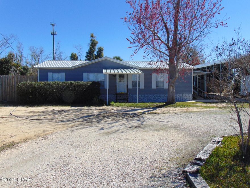 This beautifully maintained home is centrally located to shopping, restaurants and Tyndall Air Force Base.  The home offers a 61x18 motor home aluminum pole barn, a 16x24 work shop and several storage sheds.  The interior offers a large open living space, large master suite and new flooring throughout.  This home will not last long make your private showing appointment today.  All sizes are approximate and should be verified if important.
