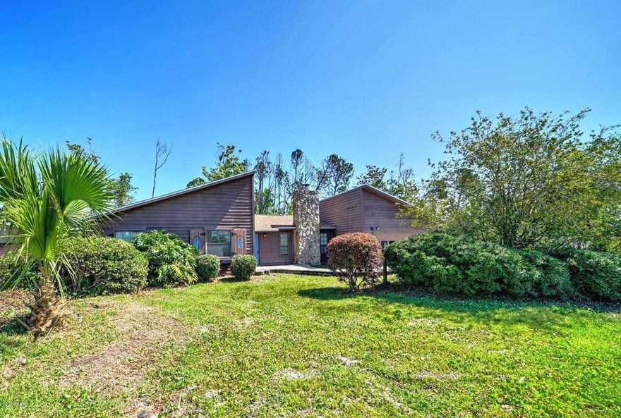 This unique Cedar side home is centrally located and backs up to a conservation area. Spacious 3 bedroom/2 bath features new kitchen, large living room with fireplace, den/office with built in bookcases and vaulted ceilings with beams. All bedrooms are large in size.  New Roof Feb 2019 (More pics coming)