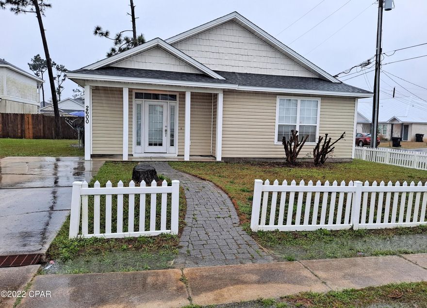 This 3-bedroom 2 bath home is centrally located, close to Tyndall AFB, Eastern Ship Building, Hospitals, shopping, and recreation. The home sits on a corner lot with a white picket fence and features a spacious kitchen with breakfast bar, a large family room with vaulted ceiling, and tile floors throughout, except for two bedrooms with carpet. The exterior is maintenance-free vinyl, with a covered front porch. Priced under 200,000, make your appointment today.