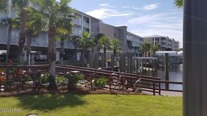 BEAUTIFULLY FURNISHED, WITH BOAT SLIP FEATURING NEWLY INSTALLED HIGH END LIFT AND COVER!  Handicap accessible. Beautiful condo, 2 bed 2 bath. Has Gulf and canal views. Condo has been updated to feature an accessible shower in the master bath with large modified closet. Nicely finished and painted. A must see condo!!!!