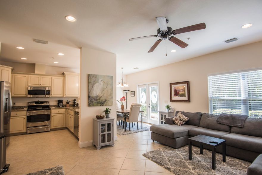 GORGEOUS END UNIT, luxury townhome in gated Annabella's community. JUST PAINTED top to bottom.  Home looks brand new!! Beautiful open kitchen, dining & family room downstairs with half bath for your guests.  SS appliances with upgraded cabinets & granite.  French doors to the back yard with only woods behind you.  Upstairs master suite with large walk-in closet, double vanity, garden tub & separate shower.  Down the hall are two light & airy guest rooms. Home sits next to large open grassy area, has 2-car garage & 2 extra parking spaces at the end of the driveway.  NEW WASHER/DRYER included.  Centrally located with easy access to everything:  Pier Park, Hathaway Bridge, beach!  Community pool, fitness rm, dog walking areas, ponds & fountains. Come check it out. You won't be disappointed.