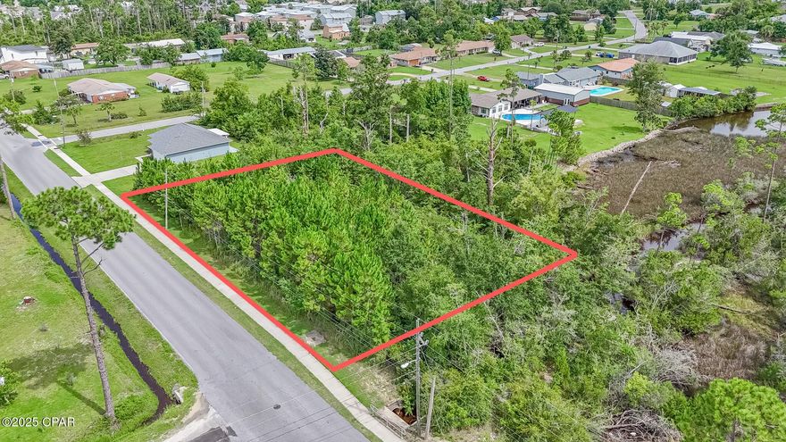 Build Your Vision in the Heart of Callaway!
Unlock the potential of this just-under-½-acre lot in one of Bay County's fastest-growing areas. Zoned R-9, you can divide the property into lots at least 50' wide (5' side setbacks, 15' rear) — perfect for multiple homesites or your dream build. Enjoy quick access to Tyndall Air Force Base, the white-sand beaches of the Gulf, and an array of local dining, shopping, and entertainment. With development surging in Callaway, now's the time to invest in a location that offers both convenience and future value.  Water and sewer are at the street.  If measurements deemed important, please verify.