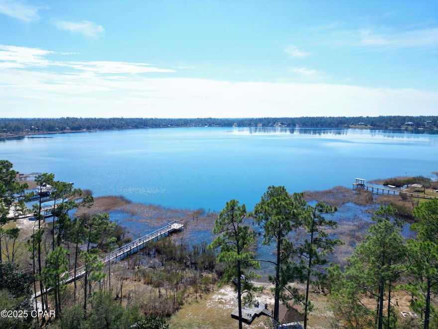 SILVER LAKE WATERFRONT LOT!  Nestled between Panama City and Marianna is one of the purest and cleanest lakes in all of Florida.    Silver Lake offers great fishing, swimming, no gas-powered boats and incredible views.  Few vacant lots remain to build your dream home, and this is one of them.     Call today to come see for yourself the beauty of this waterfront property.