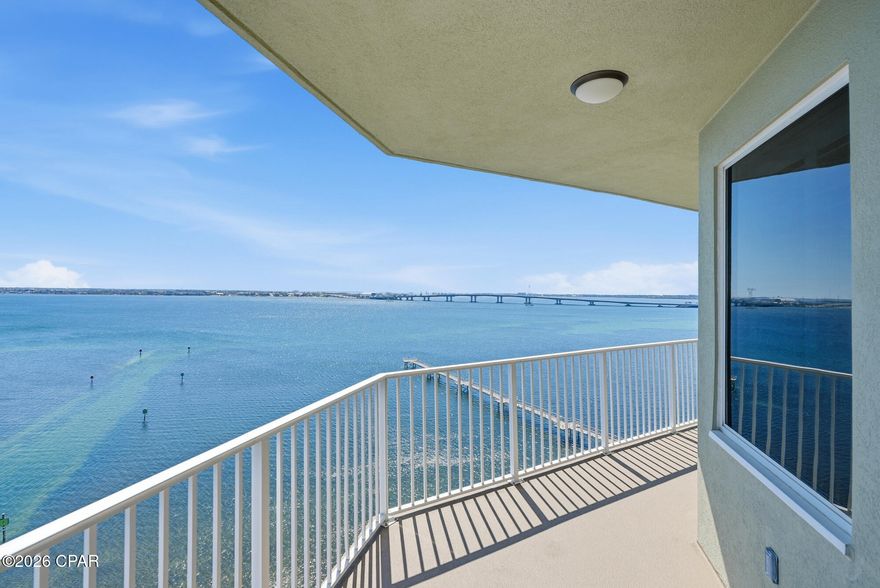 Welcome to Hibiscus by the Bay, one of the most beautiful and distinctive waterfront communities in the area, offering luxury living along the shores of St. Andrews Bay. This stunning 11th-floor end-unit 3 br 2.5 bath condo features over 2,000 square feet of thoughtfully designed living space, with breathtaking bay views from nearly every room.
Step inside to an open and airy floor plan filled with natural light and expansive windows. The spacious living area flows seamlessly onto a large bayfront balcony--perfect for enjoying morning sunrises and the sparkling evening lights of the Hathaway Bridge. Elegant finishes include tile flooring throughout, solid wood cabinetry, granite countertops, stainless steel appliances, and designer lighting.
The kitchen is both beautiful and functional, featuring custom poplar cabinetry with a rich walnut finish, a peninsula bar, dual convection ovens, a 36'' induction cooktop with stainless hood, travertine backsplash, and abundant storage. A custom wine bar with a Sub-Zero under-counter refrigerator and wine cooler adds a touch of sophistication for entertaining.
The luxurious primary suite offers private balcony access, tray ceilings, a spacious walk-in closet with updated closet storage system, and a spa-like bath with double vanities, granite counters, a custom tiled shower, and extra storage closet. Two additional bedrooms overlook the marina, offering scenic views that stretch to the West Bay Bridge. One of the bedrooms features a Murphy bed. Second bathroom features a new custom tile shower. 
This meticulously maintained residence includes numerous upgrades such as Cat 5 hurricane-rated sliding glass doors, double-pane windows, and a laundry area with granite countertops and stylish finishes. There is also a water filtrations system, whole home surge protection, and plantation shutters. 
Hibiscus by the Bay is a gated, non-short-term rental community set on 11 acres of prime bayfront property. Residents enjoy resort-style amenities including a bayfront pool and hot tub, fitness center, tennis and pickleball courts, private marina with boat slips (frequently available for purchase as well as garages), a 400-foot fishing pier, community room, library, and multiple grilling and picnic areas. The entire complex was repainted in 2024, including buildings, balconies, and breezeways. 
Whether you're a boating enthusiast, a full-time resident, or seeking a peaceful coastal retreat, this exceptional property offers the perfect blend of luxury, privacy, and waterfront living.
All measurements are approximate; buyer should verify if important.  Water heater 2025, HVAC 2021