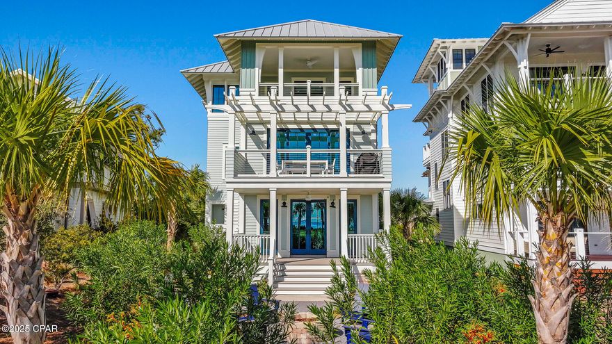 CUSTOM BAY-VIEW LUXURY IN OVATION! This stunning 4 bedroom/4 bath coastal retreat blends refined craftsmanship with unobstructed St. Joseph Bay views in one of Cape San Blas' most sought-after communities. Positioned perfectly to capture glowing sunrises & serene water vistas, this home delivers the kind of coastal living that defines the Forgotten Coast. Inside, a bright & breezy layout showcases upscale finishes throughout. The first floor features its own comfortable living/family room—an ideal spot for guests or movie nights—complete with a wet bar & easy access to outdoor spaces. Upstairs, the main living level is framed by expansive windows & full-glass sliders that frame the bay like artwork, opens to a spacious covered deck perfect for morning coffee or sunset cocktails. The gourmet kitchen shines with custom cabinetry, stainless appliances, an oversized island, pot filler & built-ins designed for effortless entertaining. The living & dining areas flow seamlessly, wrapped in natural light with designer touches at every turn. All four bedrooms include en-suite baths. The third-floor primary suite offers sweeping bay views, a spa-style bath, walk-in closet & a private balcony perfect for sunrise coffee or unwinding beneath the stars. Additional porches, thoughtful storage spaces & luxury finishes throughout make this home as functional as it is beautiful, offering room for guests, workspaces or relaxing retreats. Ovation offers unmatched amenities: bayfront infinity pool, Gulf-side pool, fitness center, clubhouse, tennis & pickleball courts, lush green spaces & deeded beach access. With downtown Port St. Joe's shops, restaurants, marina, parks & year-round community events just a short drive away, you're close to everything while still enjoying the peaceful Cape lifestyle. Call for your private tour & LIVE THE BEACH LIFE!