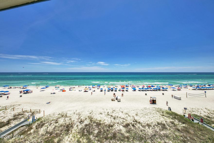 This unit offers gulf views from your private balcony and features a strong rental history. The net rental income is over $23,000 with future rentals to convey. It was recently renovated with a cooling system, furniture, decor and granite countertops in the kitchen and bathrooms. Close to all amenities of life, you are minutes away to beach, pier park, and restaurants.