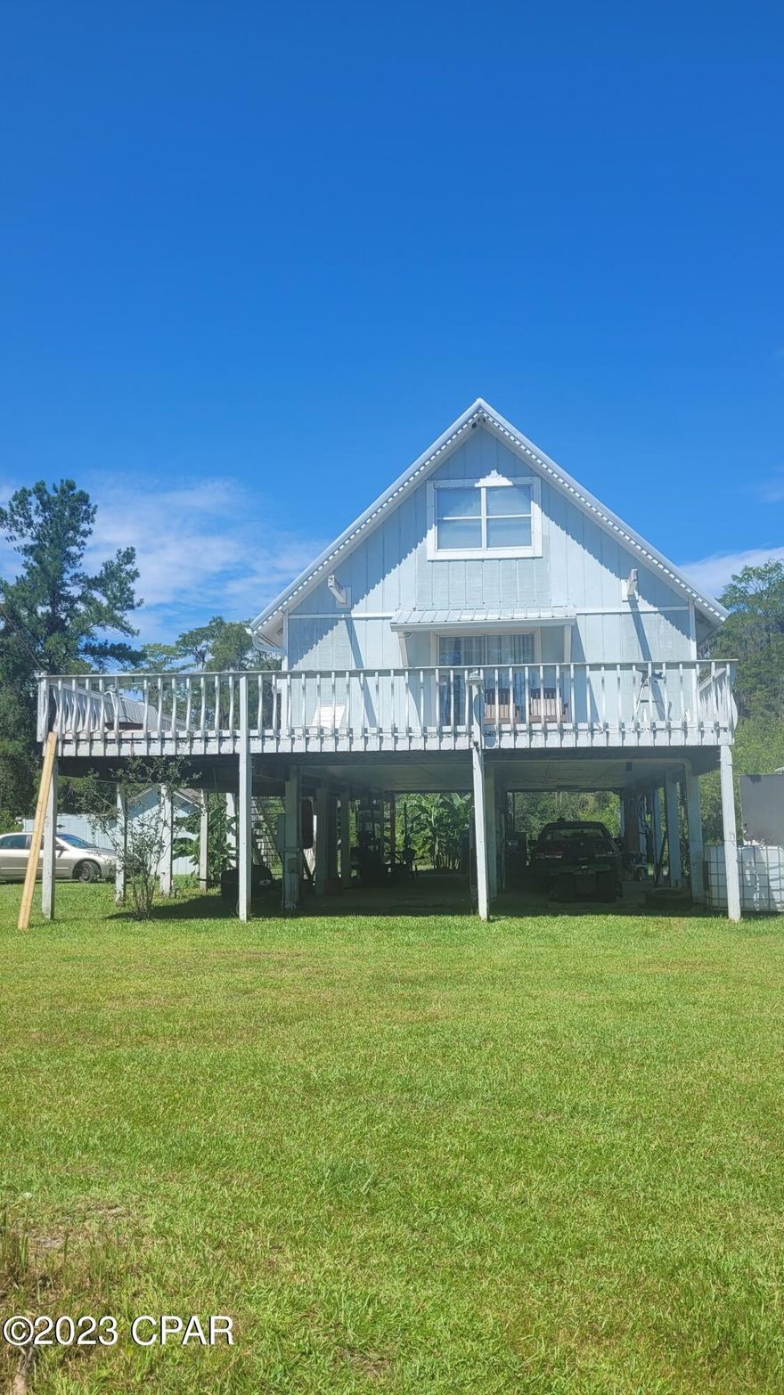 'CURRENTLY UNDER CONTRACT, SELLER WILL CONSIDER BACKUP OFFERS' If you are looking for a home with a beautiful water view, you have found it! Located in the gated community of Paradise Lakes this 3 bedroom 2 bath home sits inbetween TWO LAKES, Blue gill lake and Lake Lucas. Enjoy 11 acres of paradise by drinking your coffee and watching the sun come up over the lake on the wrap around deck, or sitting on one of the two docks to fish after a long day. If you want to jump in for an evening swim you can rinse off in a warm shower outside before going in. This property is only 40 minutes from the beaches of Panama City and Destin, and less than 20 minutes from Cypress Springs!