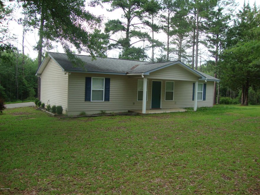 Nice newer 2 bedroom 2 bath Frame/Vinyl home on almost 2 acres. Open concept. Split bedrooms. Master bedroom has a huge master closet and large master bath. Almost like new home. Attached Carport. Concrete drive. Large attached storage room. Land is mostly fenced with gate entrance. Mostly cleared with a few shade trees. Nice and quiet peaceful area. Short distance to town.