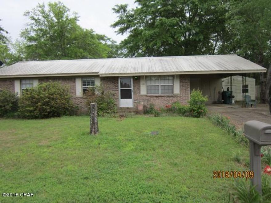 Brick house on corner lot, 3 bedrooms 1 bath, 1146 living space, with carport and outside utility room.  In Chipley city limits.  Outside storage shed with side shed for mower storage and a workbench.  Privacy fenced back yard. Landscaped. Metal roof. Bathroom has been modified as a shower only with built in seat.