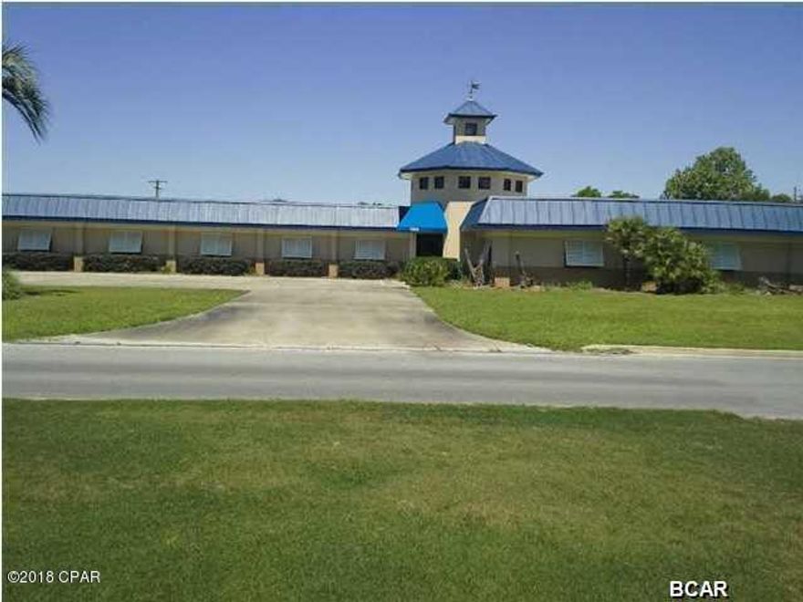 Great commercial office ideally set up for multiple business. Prime location with 1.3+ acres allows for plenty of room for the fleet with large parking capabilities. just minutes from Pier Park and City municipal offices. Large lay down yard area with 8ft privacy wall. Perfect for equipment and fleet truck parking. The building has multiple offices, perfect for medical facility and or large corporate office. Conference room for 15 plus seating. Kitchen galley with dining room. Separate entranced area of the building has 2 large private offices with bathrooms. Large foyer entrance.