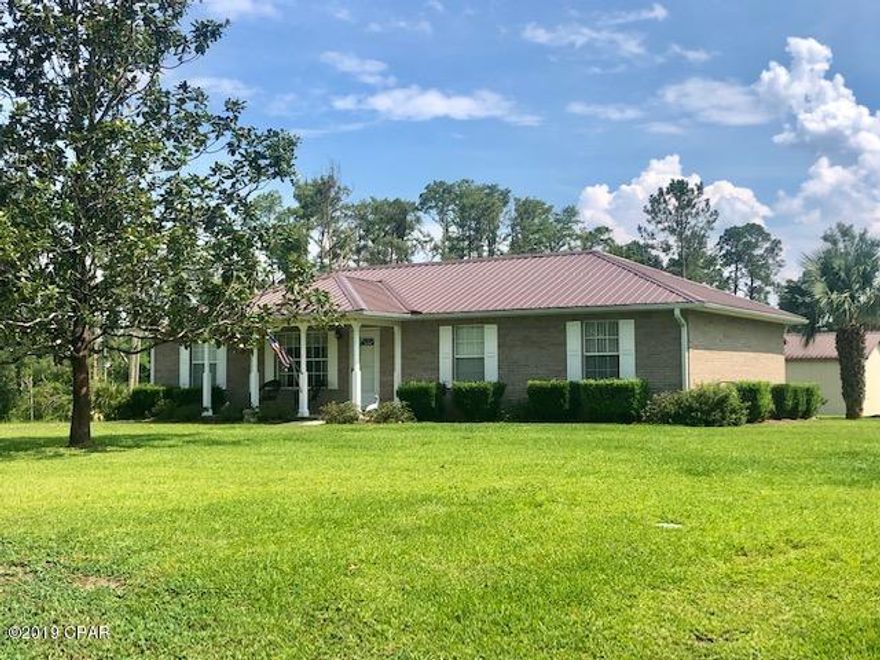 Immaculate brick home in town on 0.86 acres.  There are two detached 2 car garages in excellent condition, one with storage area.  The home has exceptionally nice features that include a formal living room, formal dining room, kitchen with breakfast area and all appliances are included.  This fine built home suffered no damages from the recent hurricane.  The roof is only 2 years old and the AC was replaced approximately 15 months ago.  There is a termite bond on the house.  Most furnishings are negotiable.   There is public water.  This is a home that has been well cared for and it will qualify for all types of financing.