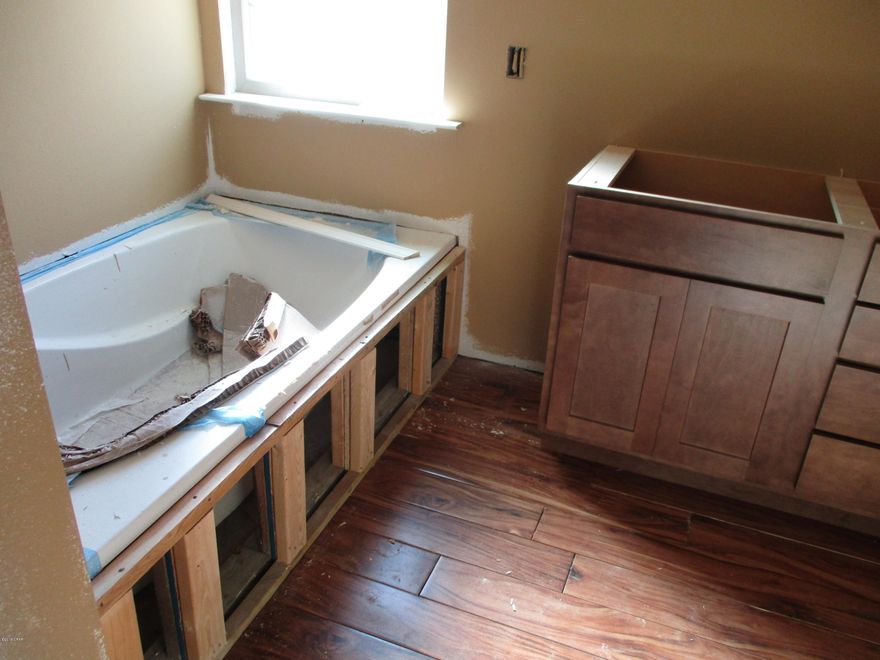 'CURRENTLY UNDER CONTRACT, SELLER ACCEPTING BACKUP OFFERS'      What a beautiful energy efficient home on a 1.5 acre lot. This is a 4 bedroom 2 bathroom home with tile floors, raised ceilings, and granite counter tops. The master bath has two walk-in closets, a garden tub and separate fiberglass shower. It has a covered porch and covered patio.