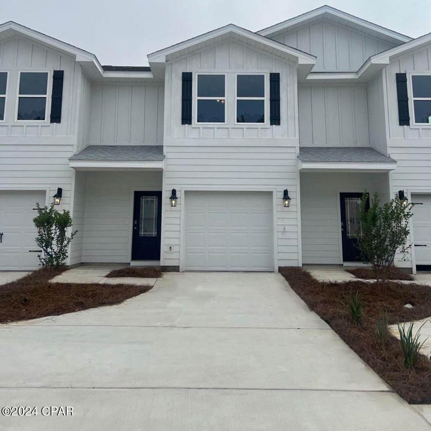 Bayside at Ward Creek is at the heart of Panama City Beach, accessible by sidewalk to Pier Park, Frank Brown Park, and the Conservation Park with the Gulf of Mexico less than 3 miles away.  | This townhome features the Palm Floor Plan with 3 bedrooms, 2.5 bathrooms, and a 1-car garage. The driveway is widened allowing 2 vehicles to fit side by side behind the single car garage.  All bedrooms are located on the second floor, leaving plenty of space on the main level for entertaining and relaxing. Beautiful interior features in this unit include bright white cabinetry in Ivory, granite countertops, a center island with stainless-steel sink, and stainless kitchen appliances which include a stove, microwave, and dishwasher.