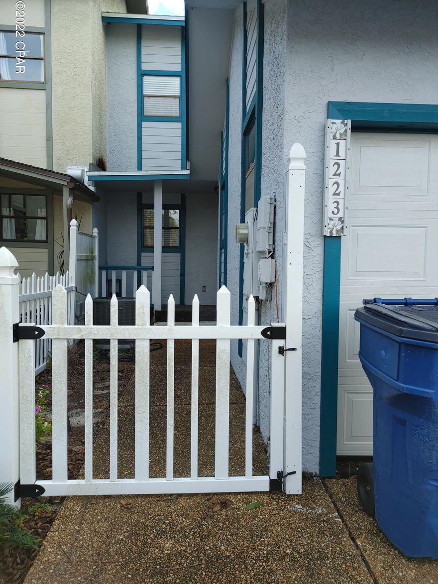 CURRENTLY UNDER CONTRACT, SELLER WILL CONSIDER BACKUP OFFERS. Very nice canal front townhome with large boat lift, patio, screened sunroom, upgraded cabinets, granite countertops, flooring and more.  Plenty of space in this property with a one car garage, large laundry room and living area and 1/2 bath downstairs with 3 bedrooms and 2 full bathrooms upstairs.  The master bedroom has a room off of it overlooking the canal which would make a great office.  The sunroom is a great place to hang after a fun filled day of boating on the Bay or Gulf of Mexico. Some furnishings may convey with the sale...ask for details if interested.