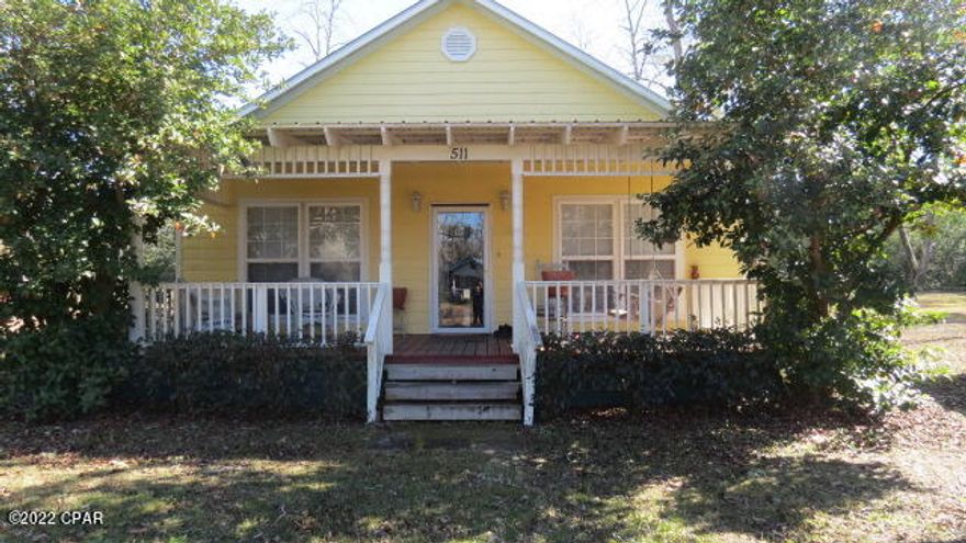 Motivated Sellers!  Very unique country home features a large front porch with beautifully crafted wood work around to top.  Enter into the open kitchen and living room area.  Large windows on the front.  Laminate flooring in all rooms.  Long hallway leads to bedrooms on either side. Each having their own bathroom.  A must see for any small family.  Home is surrounded by Pecan Trees.  Very deep lot with home being centered on the property.