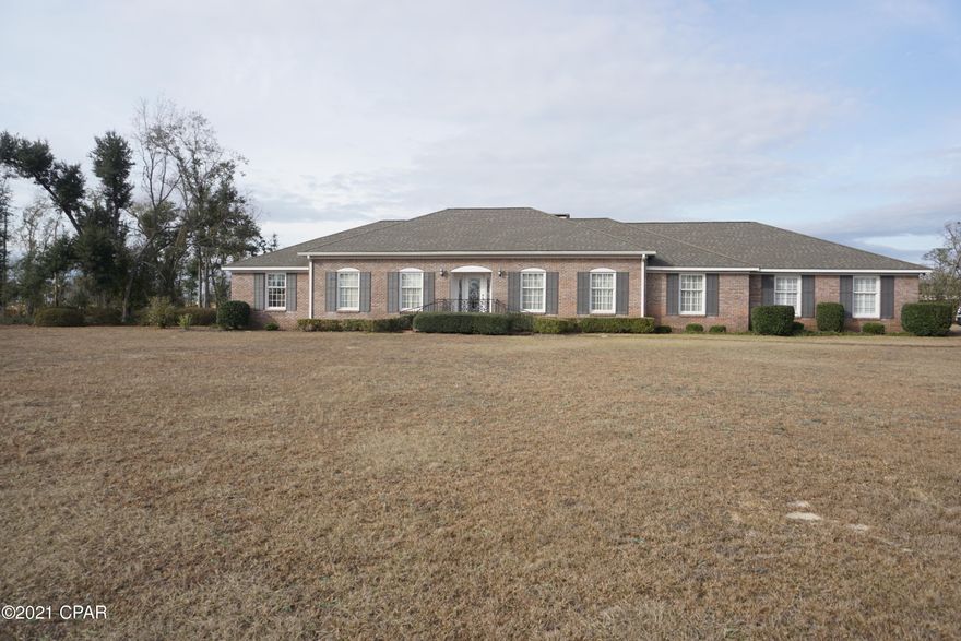 PROPERTY UNDER CONTRACT; SELLER ACCEPTING BACKUP OFFERS. Beautiful brick 3 bedroom, 2 and a half bathroom home with large living spaces on a 4 acre lot right in town. This home has a formal living room, a family room/den and an additional bonus room. In the formal living room there is a fireplace with marble surround and gas hookup. The bonus room is beautiful with a lot of windows that let in natural light, built-ins with shelving and french doors with plantation shutters that lead to the back patio. The family room/den features a brick wood burning fireplace with gas lighter and open to the breakfast area. The bedrooms are spacious, two with a jack and jill bathroom, and the master has a huge walk-in closet with built ins for storage. The laundry room has a tiled area with drain for hanging clothes to dry. One of the HVAC units was just replaced and has a transferable warranty. There is a termite bond on the home. All window treatments convey with the home.