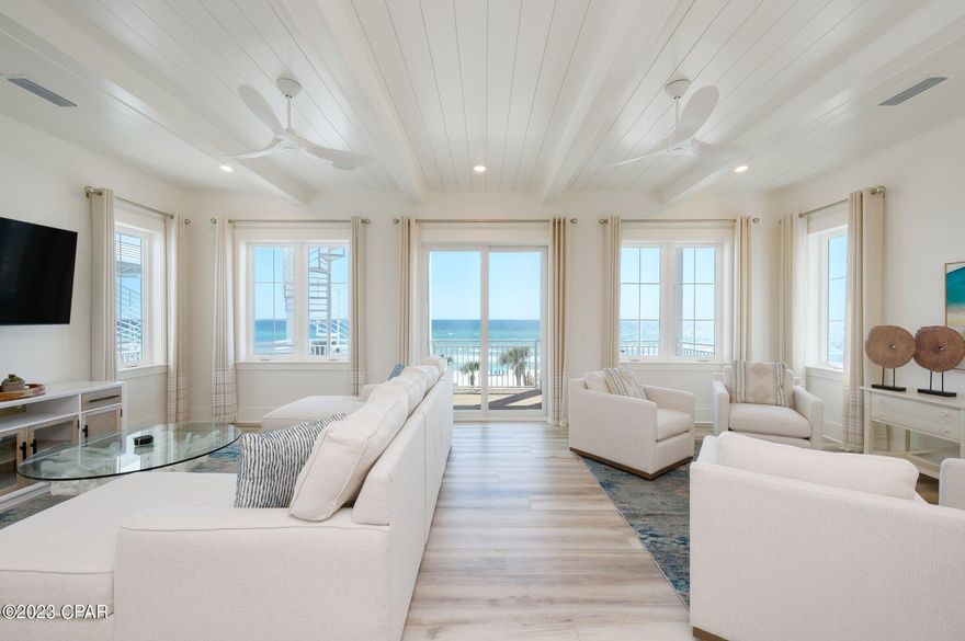 Unbelievable price on this beachfront dream home just completed, fully professionally decorated and ready for your family right now. The home is the very best Panama City Beach has to offer not just because of its stunning beach sunsets that can be enjoyed over three expansive gulf front balconies, this home is located in the new luxury Margaritaville Beach Cottage Resort. That's right Jimmy has brought us his ultimate resort experience and it comes with everything you would expect from Margaritaville. Tropical pools with bar service, water slides and lazy river for the kids, and nothing short of white glove service. If that's not enough to get you to grab your flip flops, this home features its own gulf front private pool and beach walkover. The only thing missing from this brand new stunning home is your family. Modern day amenities of this home allow for multiple generations to enjoy the beachlife, featuring a private elevator going all the way up to the third floor. Just off the pool on the first level is a great room complete with a wet bar, ice machine, full size refrigerator and a large sitting area with lots of seating, big screen tv and a foosball table. Located on this level is also a full size bathroom and bedroom. For the most stunning views of the beach this home features its living and entertaining space on the second floor. Opening up to an expansive balcony is an open concept that allows everyone to enjoy, whether you're relaxing in the deep sectional sofa, having a bite at the dining table or showing off your chef skills in the kitchen for the week featuring fresh gulf seafood, you will be sure to have a stunning view of the emerald coast's sparkling water and white sandy beach.
For the chef in the family, this kitchen is sure to not disappoint, featuring Frigidaire Professional Appliances, 36'' gas range, quartz countertops, and exquisite cabinetry. In addition to the living and entertaining space on the second level, the home also features two guest bedrooms with ensuite baths and a full size washer and dryer along with a half bath. Next on the third floor is the beachfront master suite with sweeping gulf views running east to west. Stepping out on the expansive third floor balcony allows its guest to see all the way down the panhandle's coast line. Getting ready for your day or unwinding is nothing short of luxury in the exquisite master bath, featuring a massive oversized glassed-in shower with stunning tiles and a walk-in closet. The 3rd floor also includes two additional guest bedrooms with ensuite baths, as well as another bunk area. Plenty of parking with a two-car carport, as well as three additional spaces. Owners and guests will experience the ultimate in island-inspired dining and drink options with Margaritaville's signature concepts, including The Salty Rim Bar & Grill (Now Open), Fins Restaurant and Bar (opening in 2024), and Joe Merchant's Coffee & Provisions (opening in 2024). Quench your thirst with fresh, hand-crafted cocktails while indulging in delectable entrees.Unwind in the Now Open expansive resort oasis pool, complete with private cabanas, H20 Adventure Waterslides, and a 425-foot lazy river. But that's not all! With many new amenities on the horizon, endless entertainment awaits. Engage in a friendly game of pickleball, participate in activities on the lawn, or test your skills in the indoor arcade. At Margaritaville, they cater to every preference. If relaxation is your goal, soak up the sun on the beach. If adventure is your calling, try the bike rentals or paddleboard lessons. With options to suit every itinerary, Margaritaville promises an unforgettable beach experience. Call today for additional information on the resort, rental income potential and to see this beautiful beachfront home.